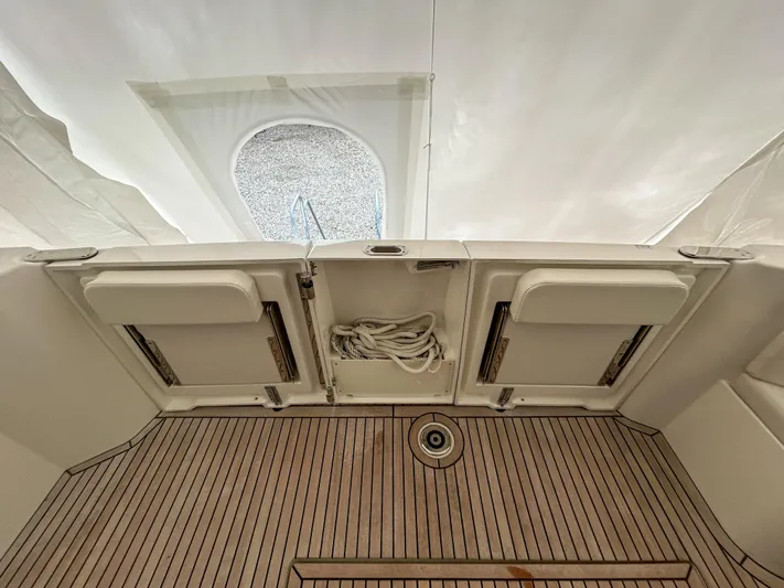  Yacht Photos Pics 2023 Beneteau Swift Trawler 35 deck with teak flooring and storage compartments.
