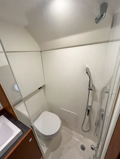  Yacht Photos Pics 2023 Beneteau Swift Trawler 35 bathroom with modern shower and toilet.