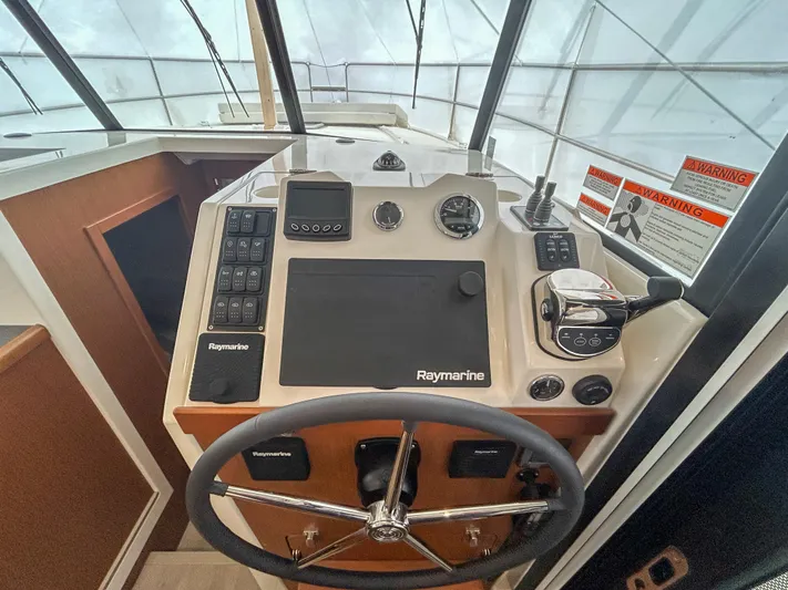  Yacht Photos Pics 2023 Beneteau Swift Trawler 35 helm with Raymarine navigation system.