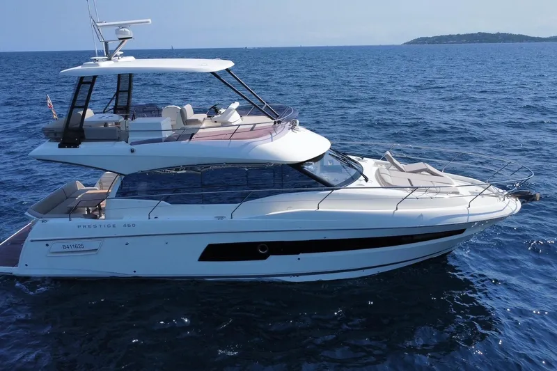  Yacht Photos Pics 2021 Prestige 460 yacht cruising on open sea, showcasing sleek design and luxury features.