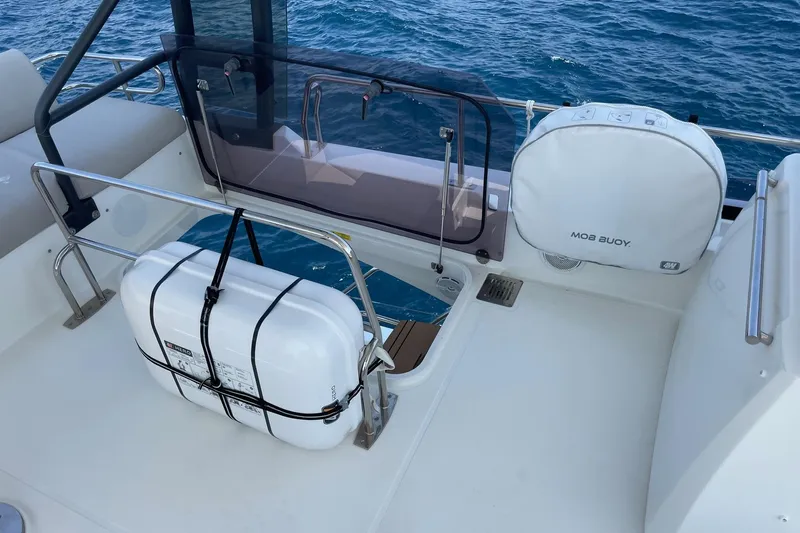  Yacht Photos Pics Prestige 460 yacht deck with safety equipment, including a MOB buoy and life raft.