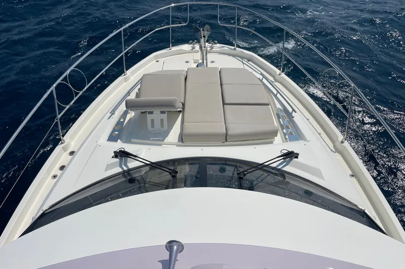  Yacht Photos Pics Prestige 460 yacht (2021) with sunbathing area on open sea.