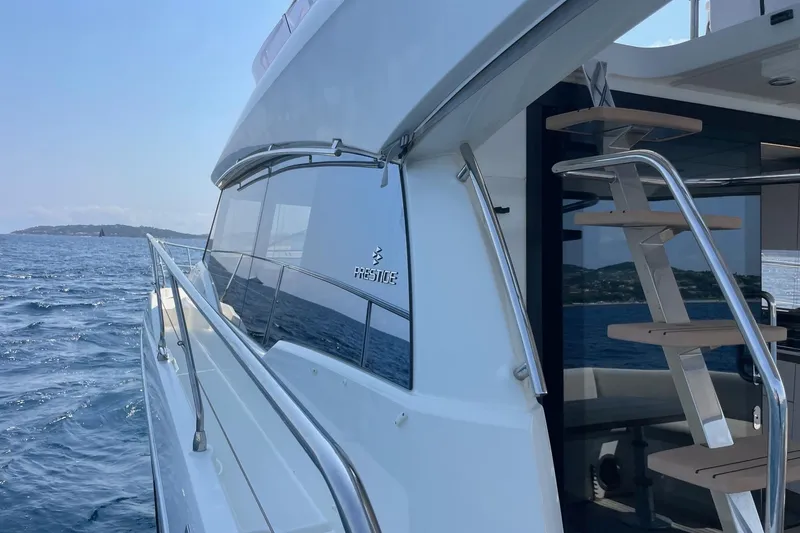  Yacht Photos Pics 2021 Prestige 460 yacht on open sea, showcasing sleek design and modern features.