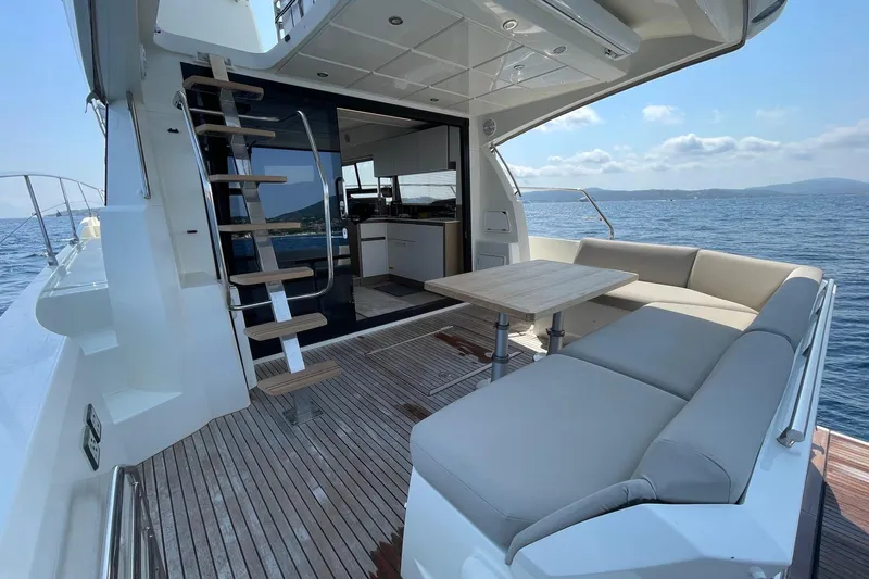  Yacht Photos Pics Prestige 460 yacht 2021 model, featuring elegant deck seating and ocean view.