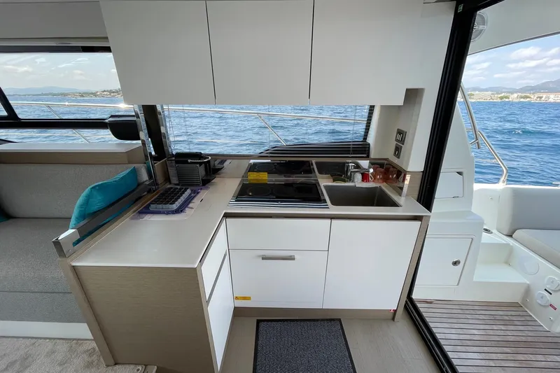  Yacht Photos Pics Modern kitchen on 2021 Prestige 460 yacht with ocean view.