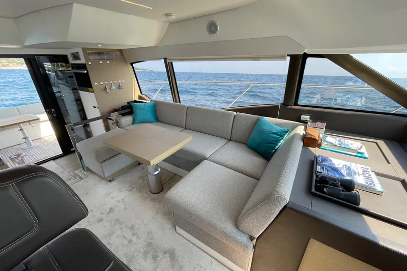  Yacht Photos Pics Luxurious interior of 2021 Prestige 460 yacht with ocean view and modern seating.