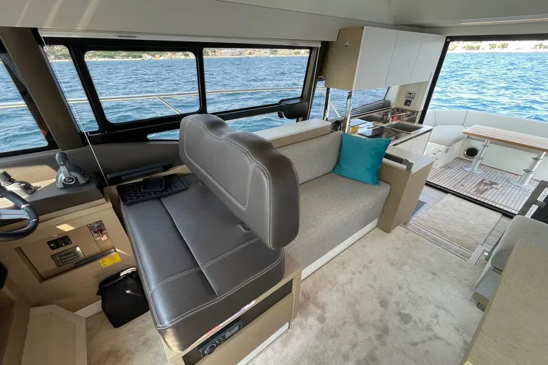  Yacht Photos Pics Interior of 2021 Prestige 460 yacht with modern seating and ocean view.