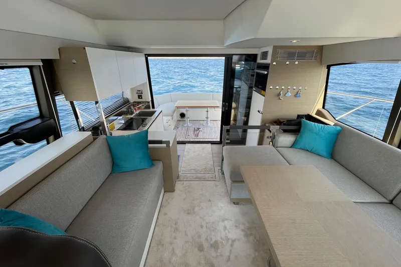  Yacht Photos Pics Luxurious interior of 2021 Prestige 460 yacht with modern seating and ocean view.