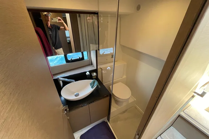  Yacht Photos Pics Modern bathroom interior in 2021 Prestige 460 yacht, featuring sleek sink and compact design.