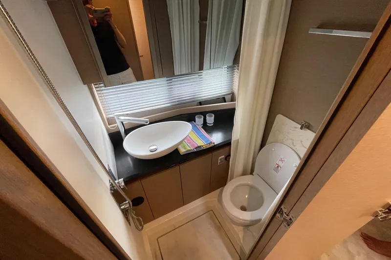 Yacht Photos Pics Modern bathroom in 2021 Prestige 460 yacht with sleek sink and toilet.