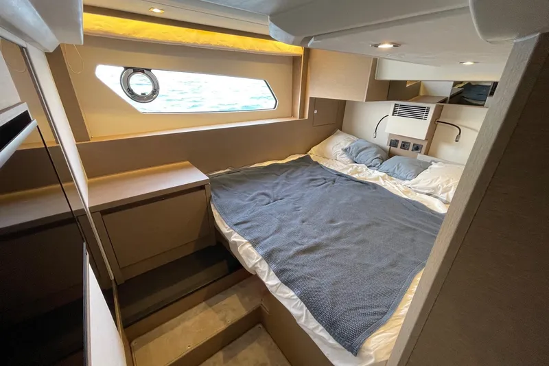 Yacht Photos Pics Luxurious cabin interior of 2021 Prestige 460 yacht with cozy bedding and modern design.