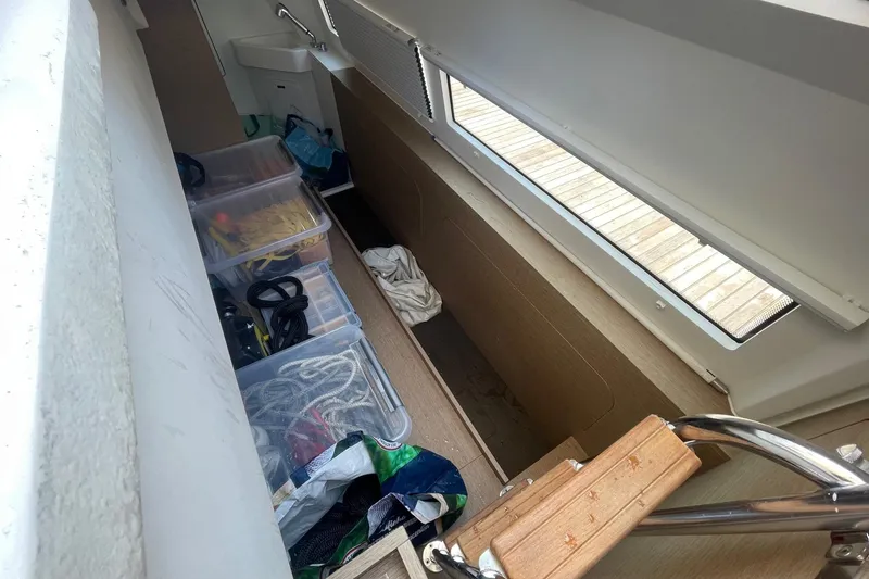  Yacht Photos Pics Storage area on a 2021 Prestige 460 yacht with organized equipment and supplies.