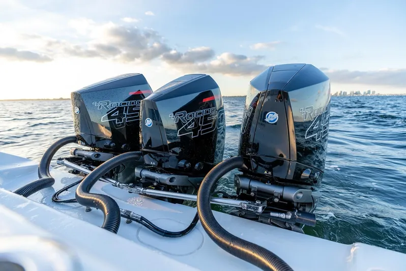  Yacht Photos Pics Triple outboard engines on a 2023 Yellowfin 34 Offshore boat in open water.