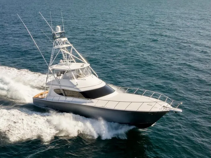 Resilient Yacht Photos Pics 2018 Hatteras GT70 yacht cruising on open sea, showcasing sleek design and performance.