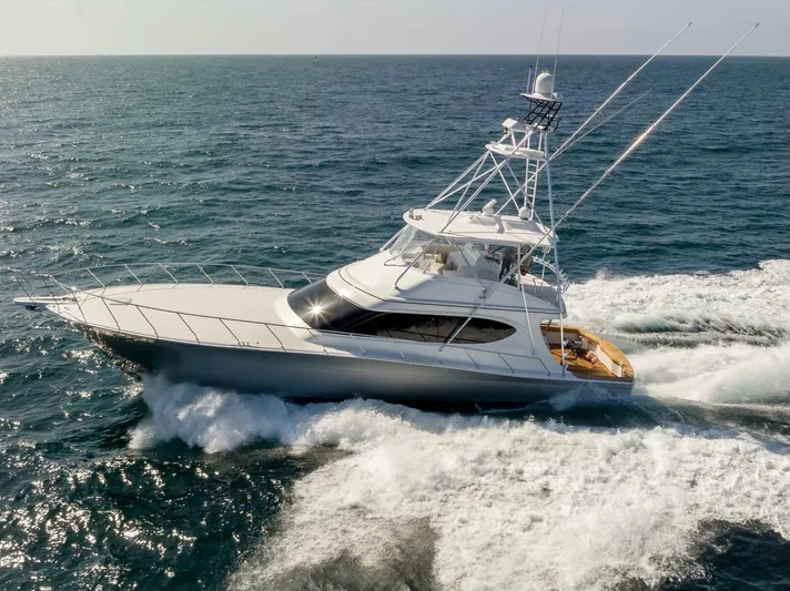 Resilient Yacht Photos Pics 2018 Hatteras GT70 yacht cruising on open sea, showcasing sleek design and powerful performance.