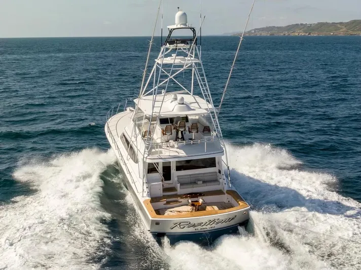 Resilient Yacht Photos Pics 2018 Hatteras GT70 yacht cruising on open sea, rear view.