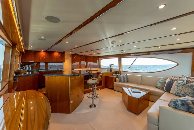 Resilient Yacht Photos Pics Luxurious interior of 2018 Hatteras GT70 yacht with elegant wood finishes and ocean view.