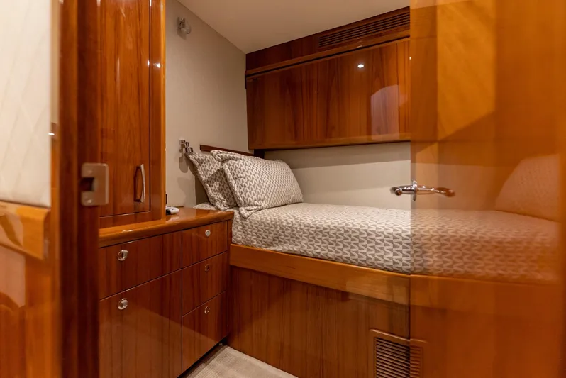 Resilient Yacht Photos Pics Luxurious cabin interior of 2018 Hatteras GT70 yacht with wooden furnishings.