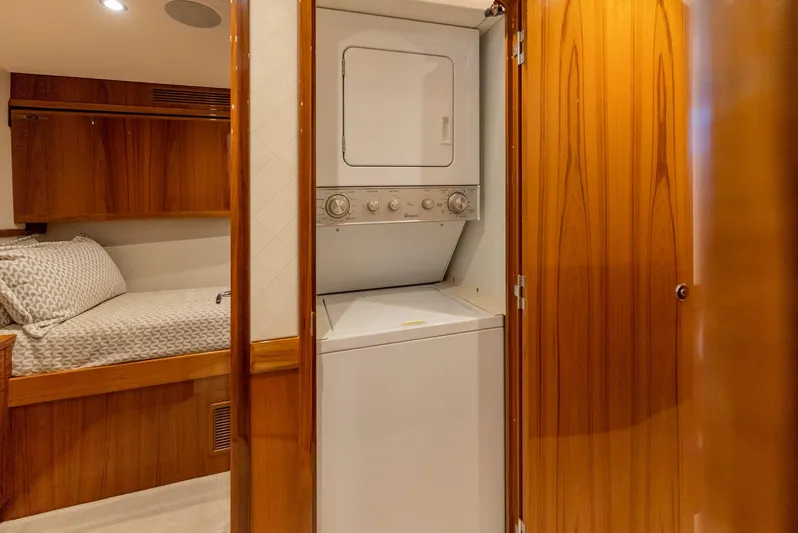 Resilient Yacht Photos Pics 2018 Hatteras GT70 yacht interior with washer-dryer and cozy bedroom.