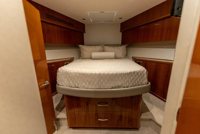 Resilient Yacht Photos Pics Luxurious cabin interior of 2018 Hatteras GT70 yacht with elegant wood finish.