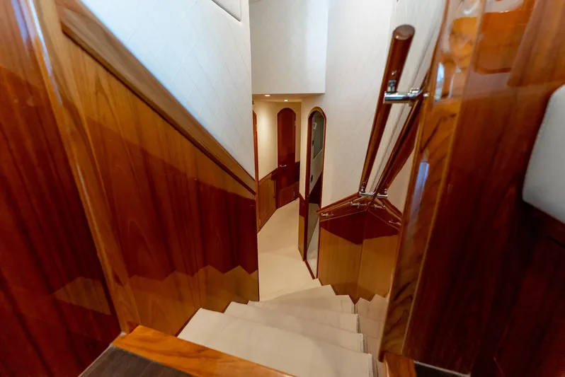 Resilient Yacht Photos Pics Luxurious wooden staircase inside a 2018 Hatteras GT70 yacht.