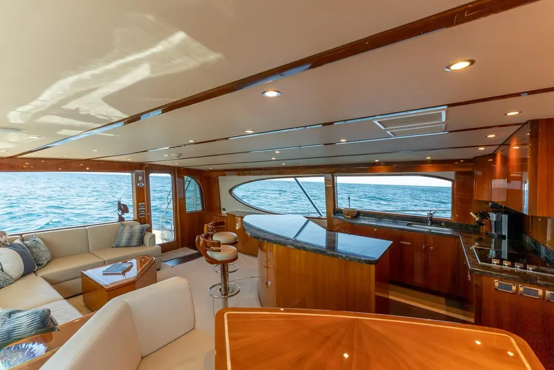 Resilient Yacht Photos Pics Luxurious interior of 2018 Hatteras GT70 yacht with ocean view and elegant furnishings.
