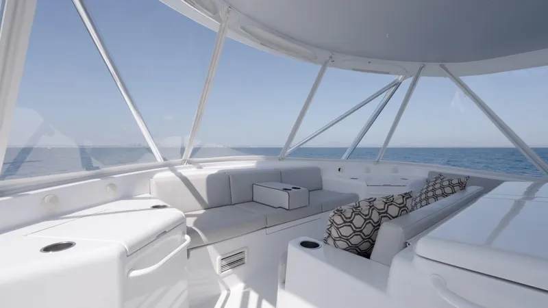 Resilient Yacht Photos Pics Luxurious interior of 2018 Hatteras GT70 yacht with ocean view and elegant seating.