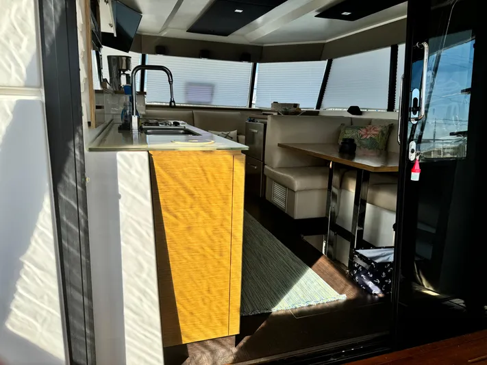 King's Ransom Yacht Photos Pics Interior of 2017 Fountaine Pajot MY 37 yacht with modern kitchen and seating area.