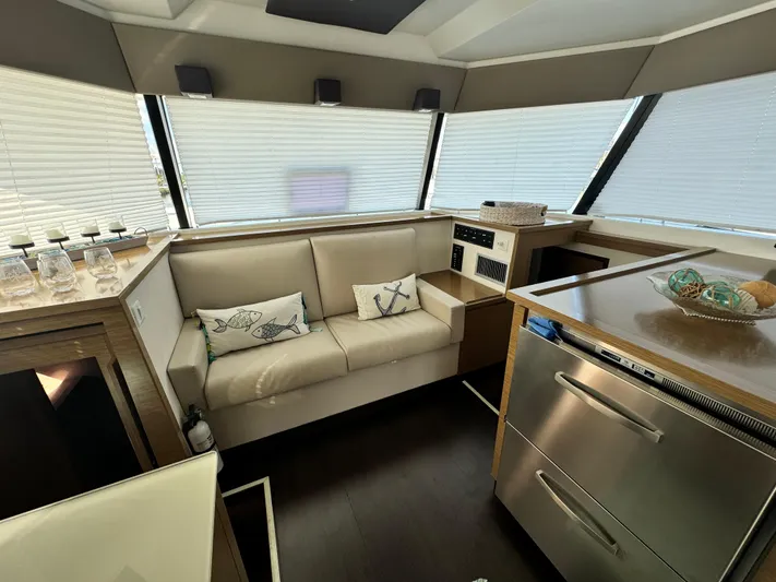King's Ransom Yacht Photos Pics Luxurious interior of 2017 Fountaine Pajot MY 37 yacht with modern kitchen and seating area.