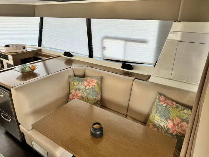 King's Ransom Yacht Photos Pics Interior of 2017 Fountaine Pajot MY 37 yacht with cozy seating and floral cushions.