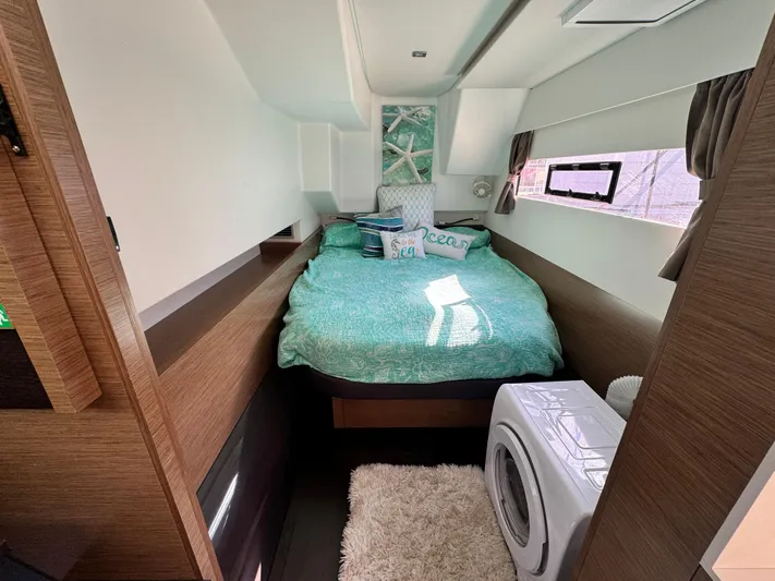 King's Ransom Yacht Photos Pics Cozy bedroom in 2017 Fountaine Pajot MY 37 yacht with bed and washing machine.