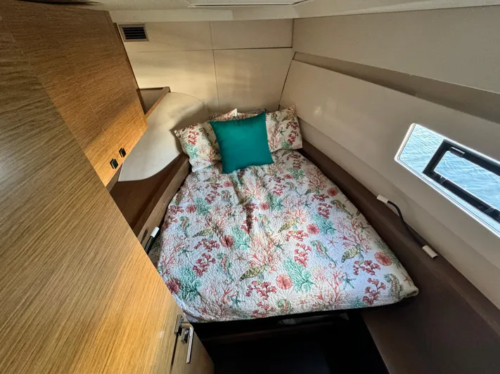 King's Ransom Yacht Photos Pics Cozy cabin interior of 2017 Fountaine Pajot MY 37 with floral bedding.