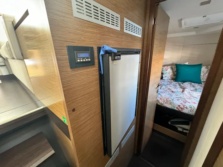 King's Ransom Yacht Photos Pics 2017 Fountaine Pajot MY 37 interior with fridge and cozy bedroom.