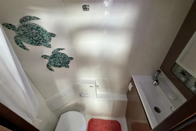 King's Ransom Yacht Photos Pics Bathroom in 2017 Fountaine Pajot MY 37 yacht with turtle wall art.