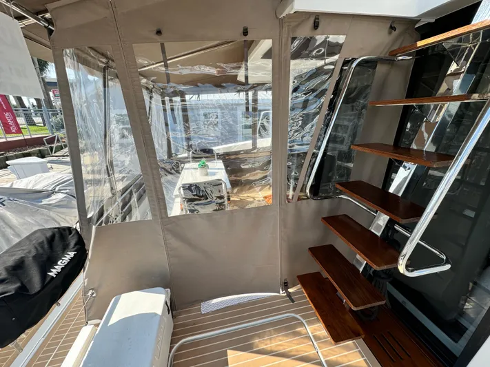 King's Ransom Yacht Photos Pics Fountaine Pajot MY 37 yacht interior with wooden stairs and seating area, 2017 model.
