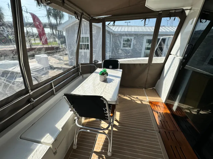 King's Ransom Yacht Photos Pics 2017 Fountaine Pajot MY 37 yacht interior with dining area and panoramic windows.