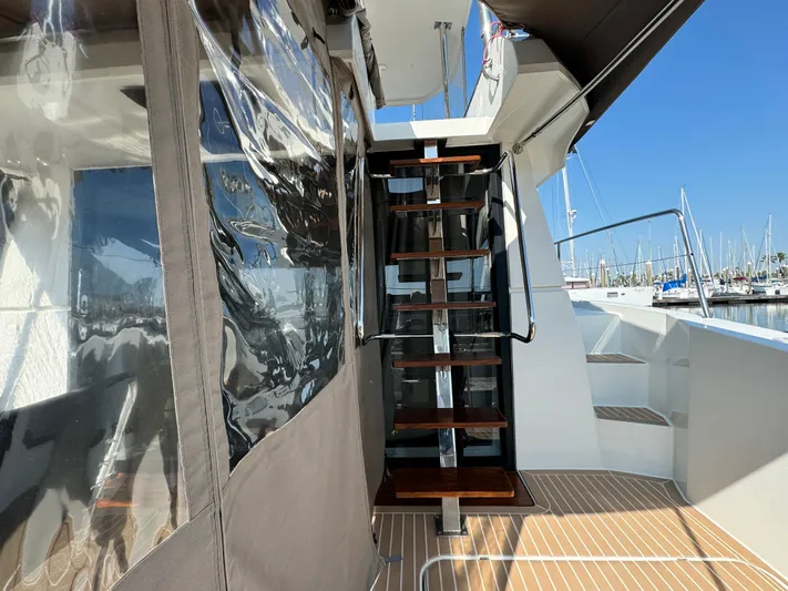 King's Ransom Yacht Photos Pics Fountaine Pajot MY 37 yacht, 2017 model, featuring outdoor stairs and marina view.