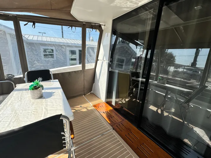 King's Ransom Yacht Photos Pics 2017 Fountaine Pajot MY 37 yacht interior with dining area and glass doors.