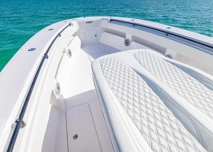  Yacht Photos Pics 2025 Invincible 36 Open Fisherman boat interior with quilted seating, on clear blue water.