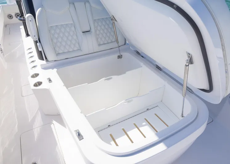  Yacht Photos Pics 2025 Invincible 36 Open Fisherman boat with open storage compartment and cushioned seating.