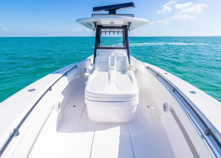  Yacht Photos Pics 2025 Invincible 36 Open Fisherman boat on clear blue ocean waters.