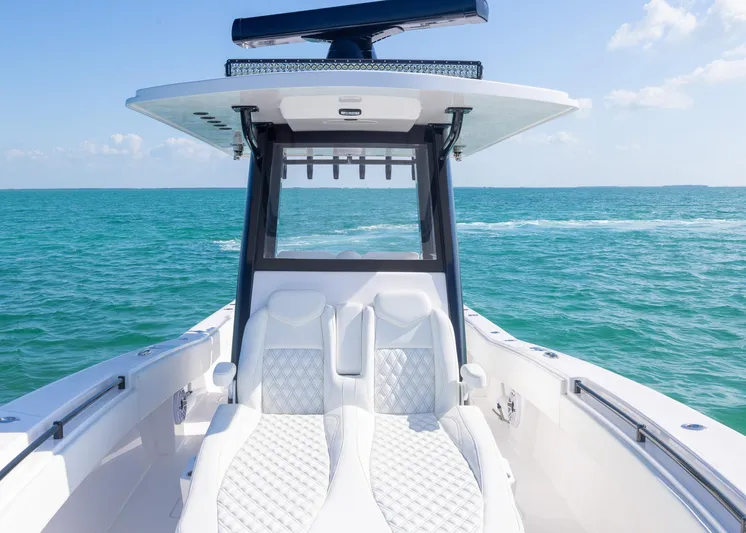  Yacht Photos Pics 2025 Invincible 36 Open Fisherman boat on open sea, featuring sleek design and comfortable seating.