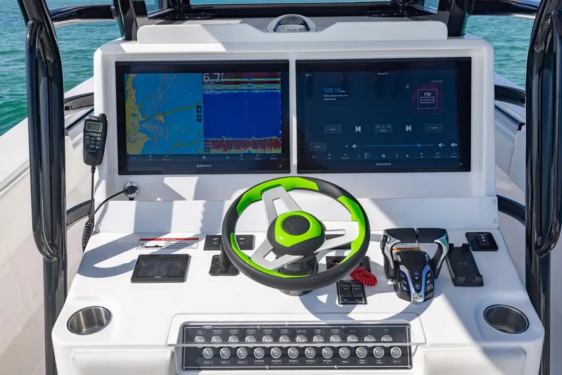  Yacht Photos Pics 2025 Invincible 36 Open Fisherman dashboard with dual screens and modern controls.