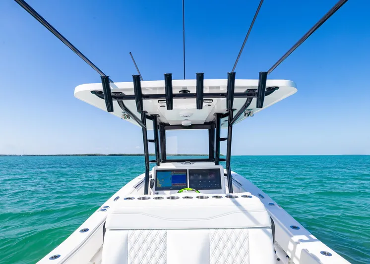  Yacht Photos Pics 2025 Invincible 36 Open Fisherman boat on clear blue ocean.