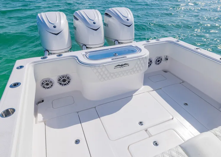  Yacht Photos Pics 2025 Invincible 36 Open Fisherman boat with triple engines on clear blue water.