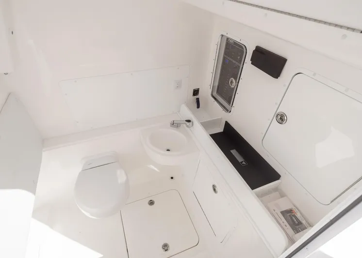  Yacht Photos Pics 2025 Invincible 36 Open Fisherman boat interior with toilet and sink.
