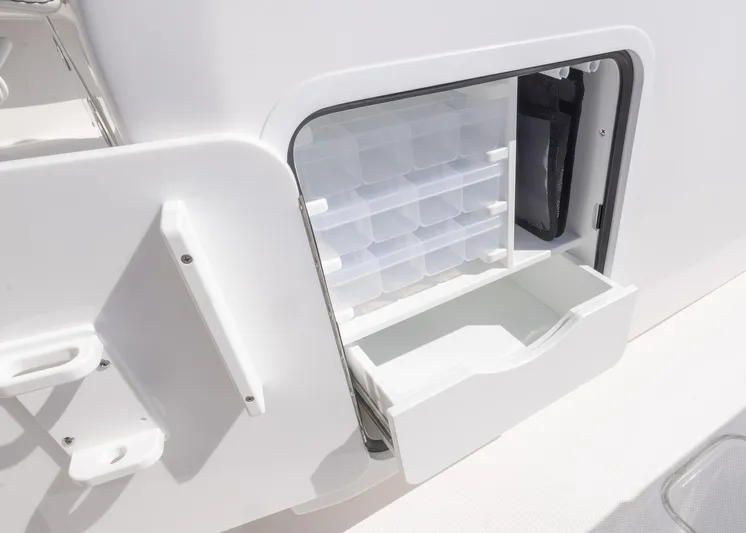  Yacht Photos Pics 2025 Invincible 36 Open Fisherman storage compartment with organized tackle boxes.