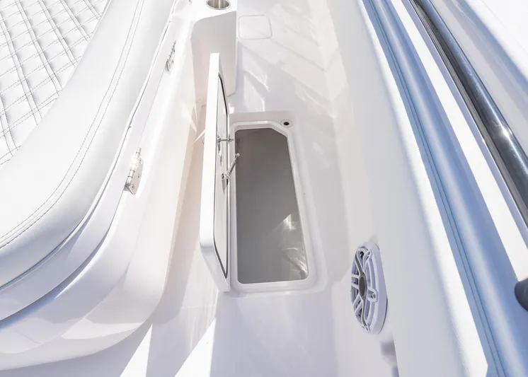  Yacht Photos Pics 2025 Invincible 36 Open Fisherman boat interior storage compartment with speaker.