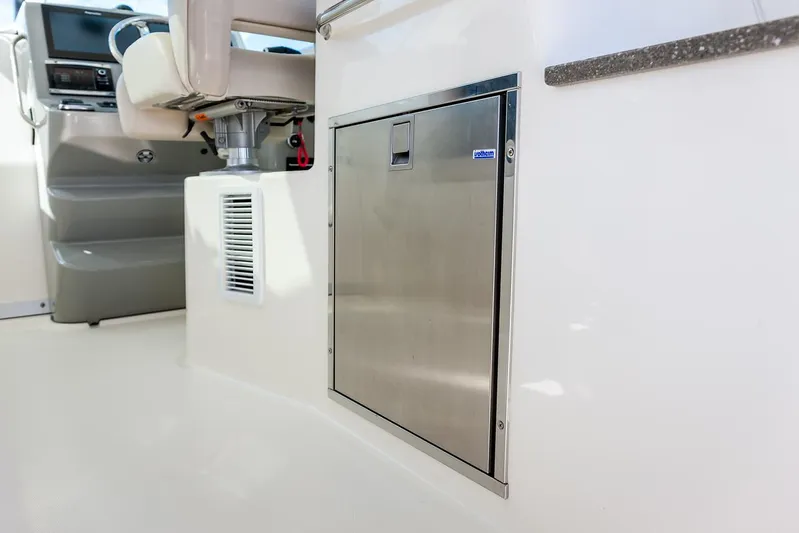  Yacht Photos Pics Manufacturer Provided Image: 2021 Boston Whaler 345 Conquest interior, featuring a stainless steel storage compartment.