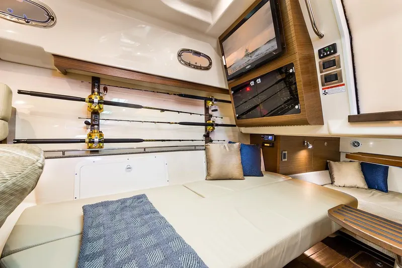 Yacht Photos Pics Manufacturer Provided Image: Interior cabin of 2021 Boston Whaler 345 Conquest with fishing rods and TV.